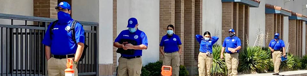 students standing outside socially distanced