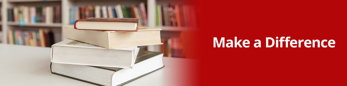 Stack of books on a library table. Informative Text: Make a Difference