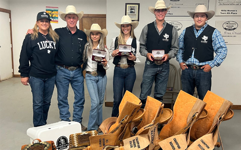 Rodeo students pose alongside Coach Joey Almand and wife, Sugar.